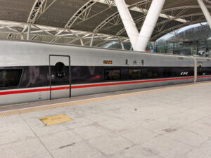 A Fuxing CR400 high-speed train at a station platform in China