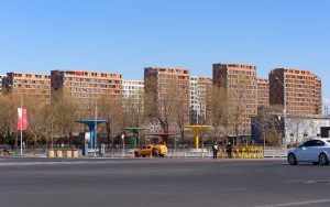 Snowy winter street scene in Beijing suggesting heating season