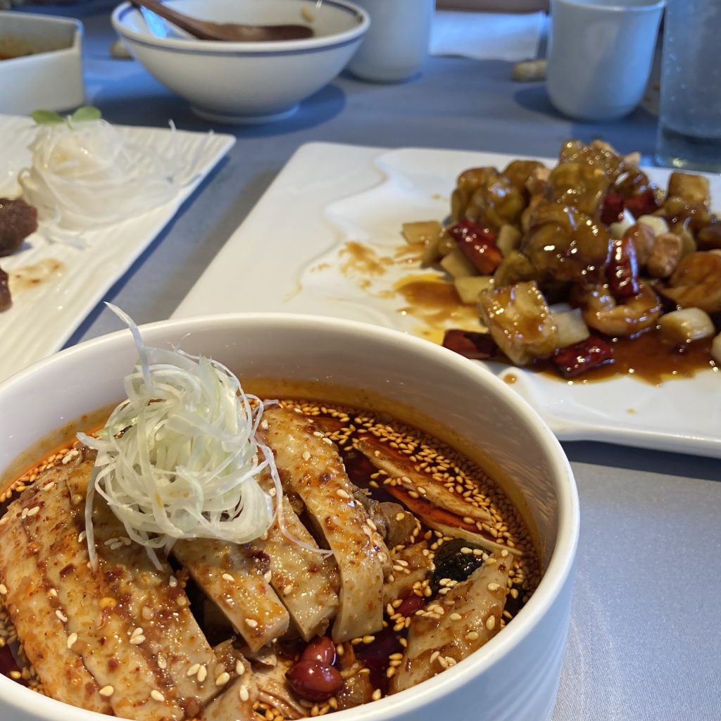 Sichuan bang bang chicken (bangbang ji) with shredded chicken topped with chili oil and sesame-style sauce