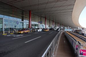 Interior of Beijing Capital International Airport Terminal 3 with high arched ceiling and open concourse