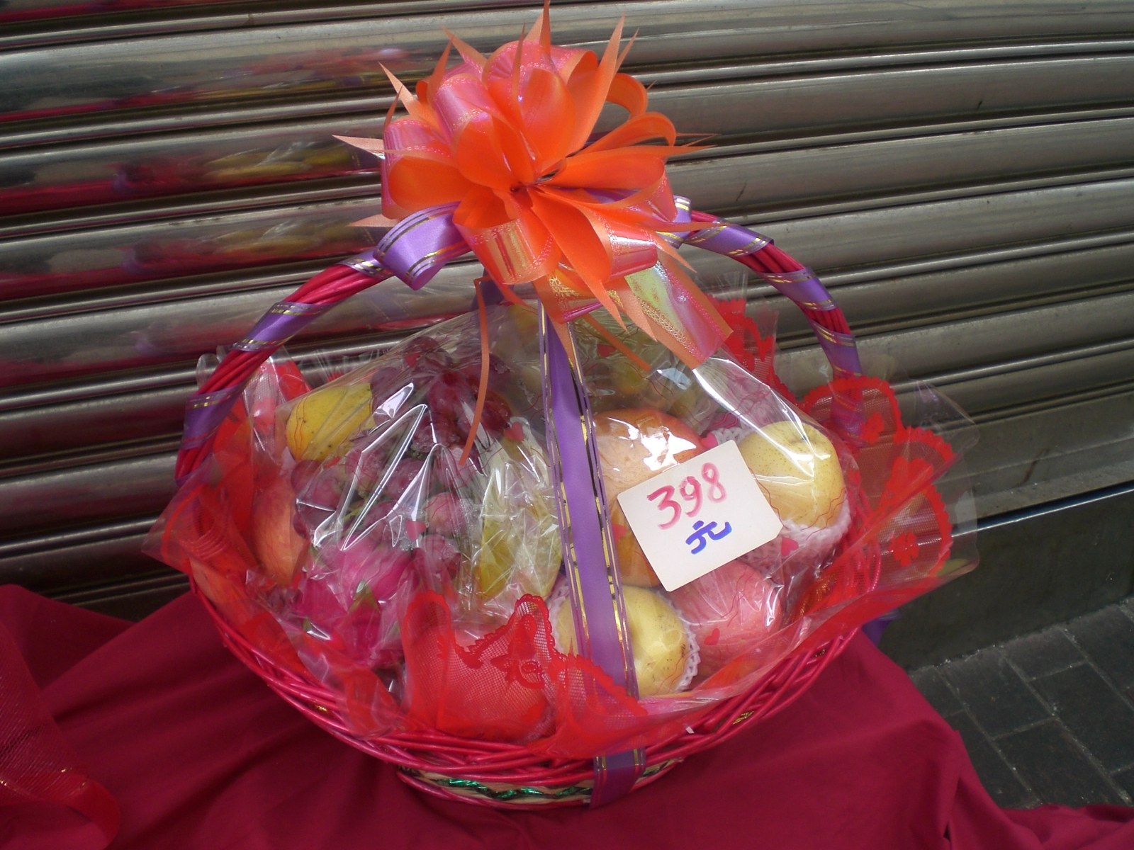 Assorted fruit gift basket wrapped for a Chinese holiday
