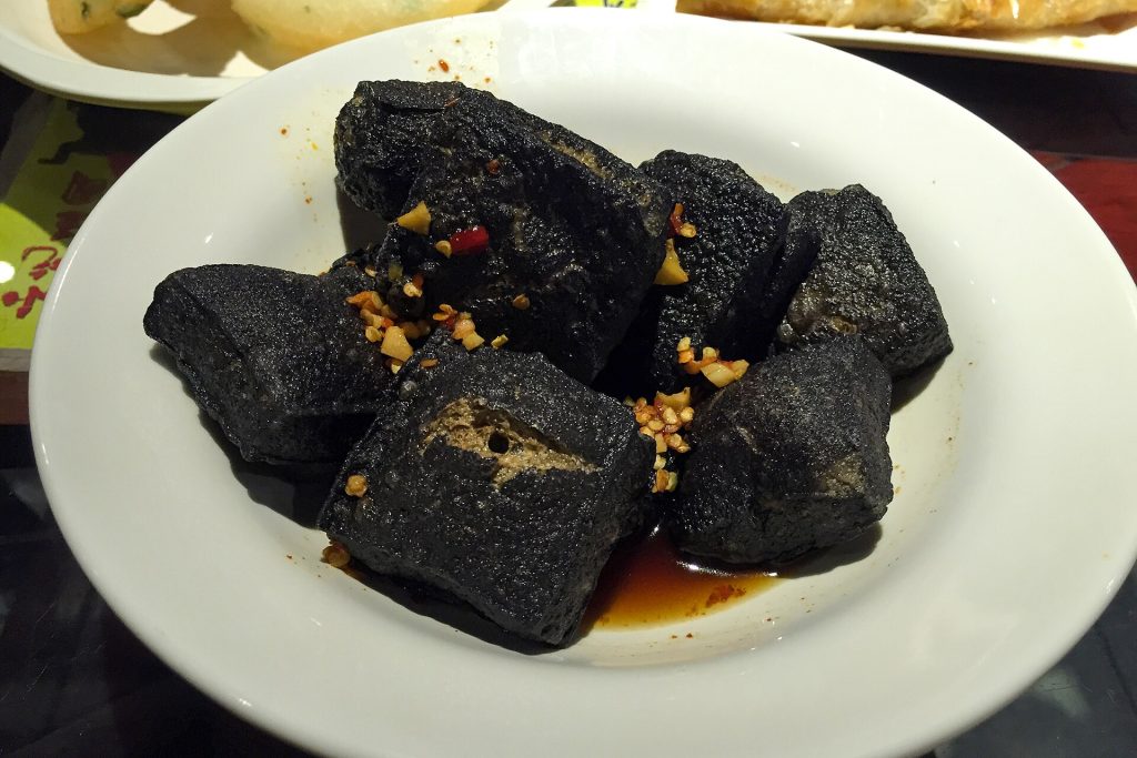 Stinky tofu skewers or plate with chilli sauce