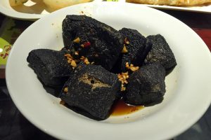 Stinky tofu skewers or plate with chilli sauce