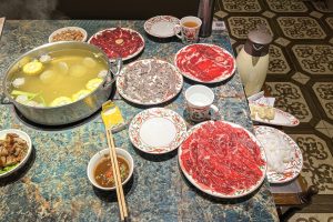 Chaozhou Chaoshan beef hotpot with sliced raw beef ready to cook in clear broth