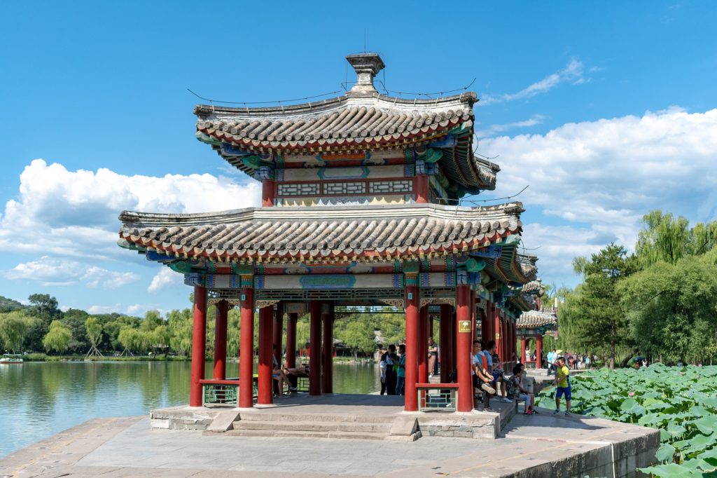 Historic halls and trees inside Chengde Mountain Resort under a bright sky