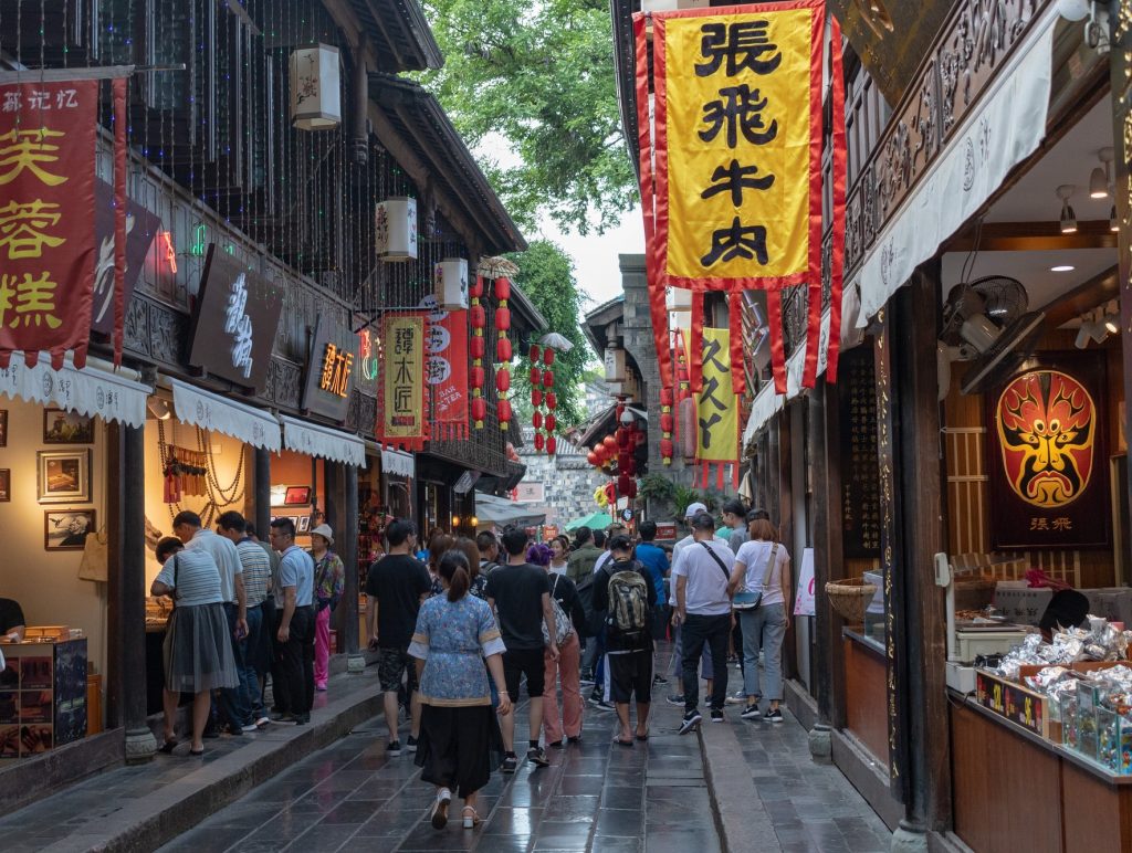 Traditional wooden streetscape with lanterns along Jinli Old Street in Chengdu