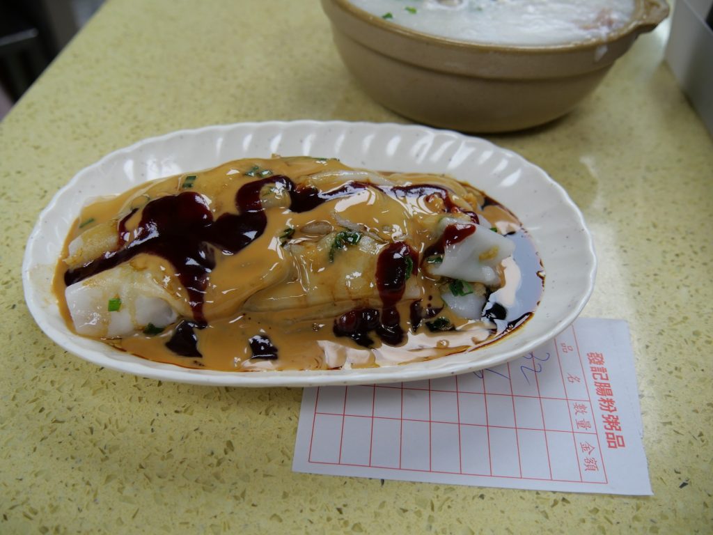 White Cantonese rice noodle rolls with shallots, peanut sauce, and savory dressing