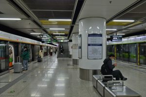 Beijing Subway platform at Beijing West Railway Station with trains and signage