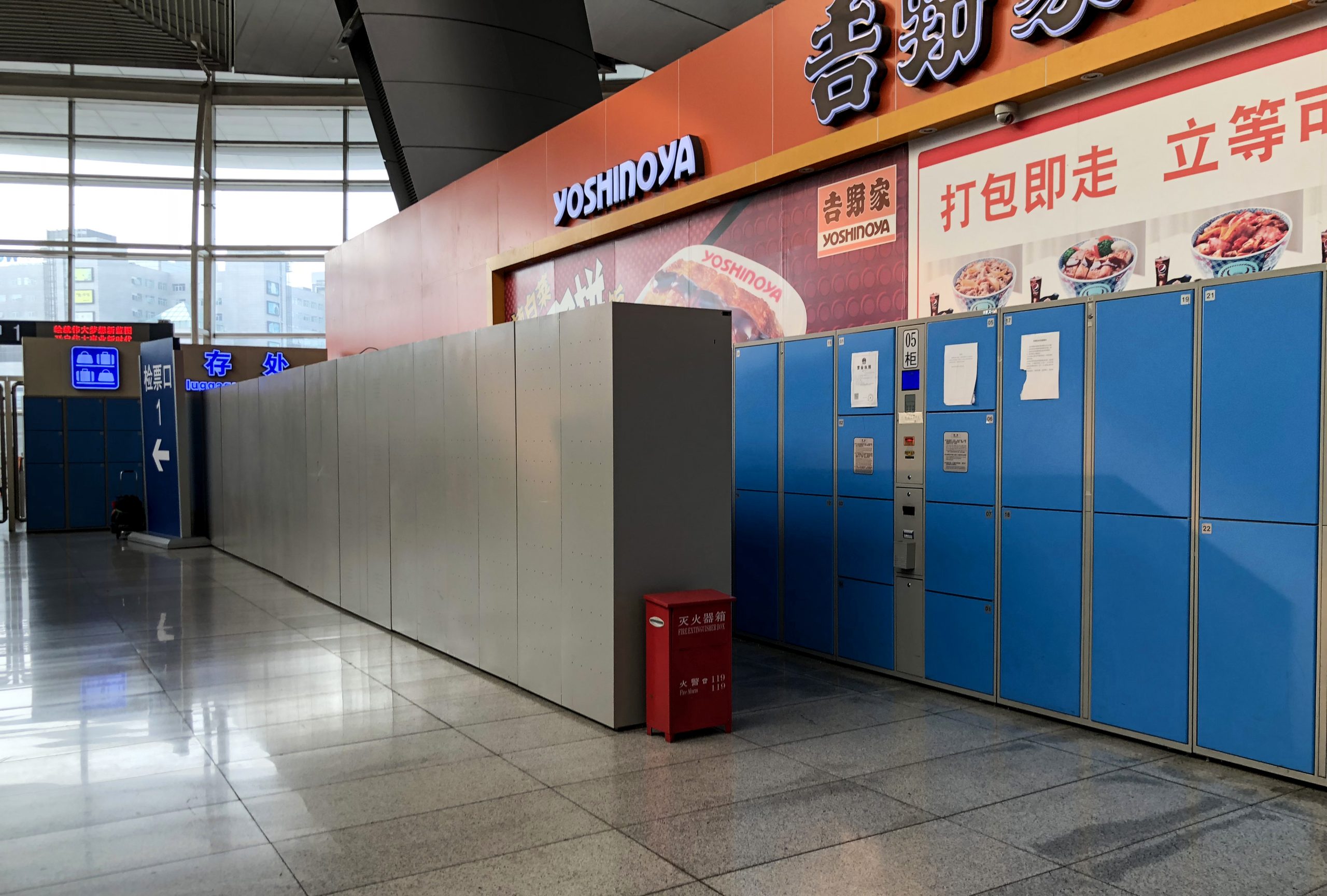 Luggage or suitcase near a Chinese railway station concourse