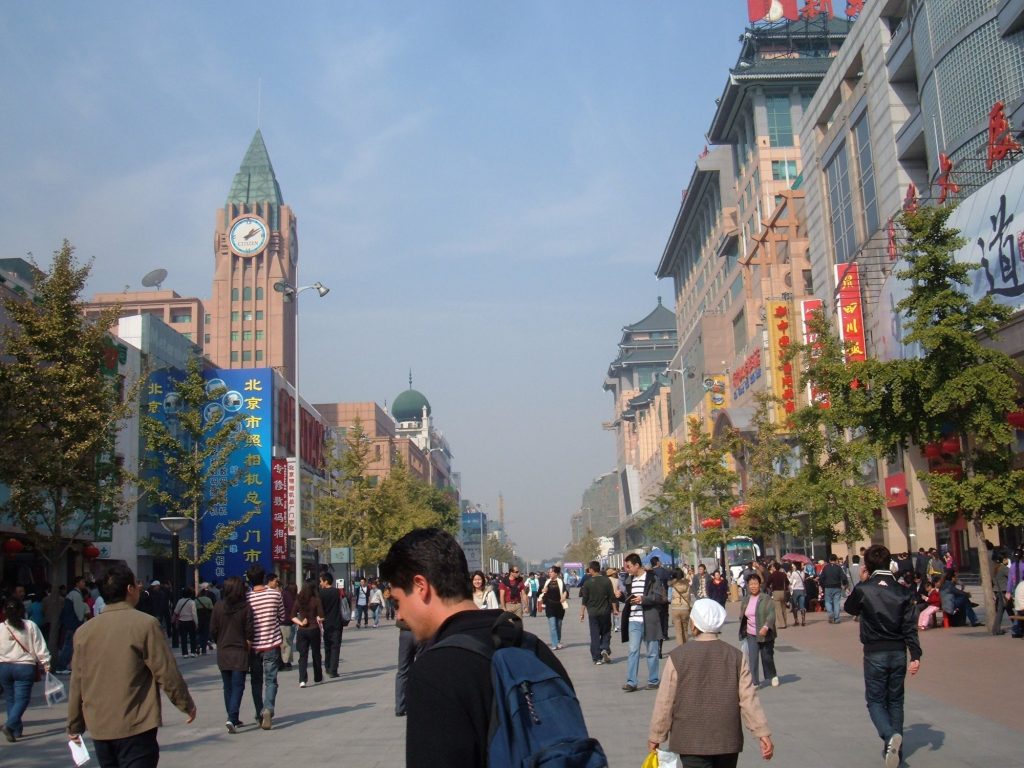 Pedestrians on Wangfujing shopping street in Beijing on an autumn day