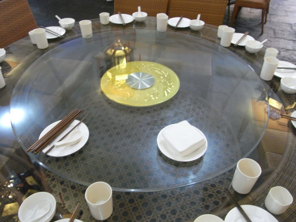 Chinese restaurant table setting with bowls and chopsticks