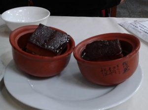 Braised Hangzhou Dongpo pork cubes glazed and plated