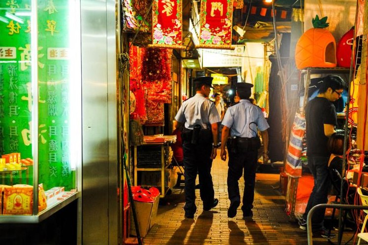 Dense Hong Kong urban streetscape with towers and signage