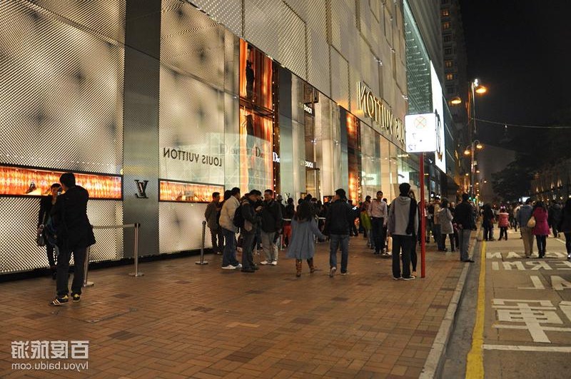 Night crowd outside luxury stores in Tsim Sha Tsui