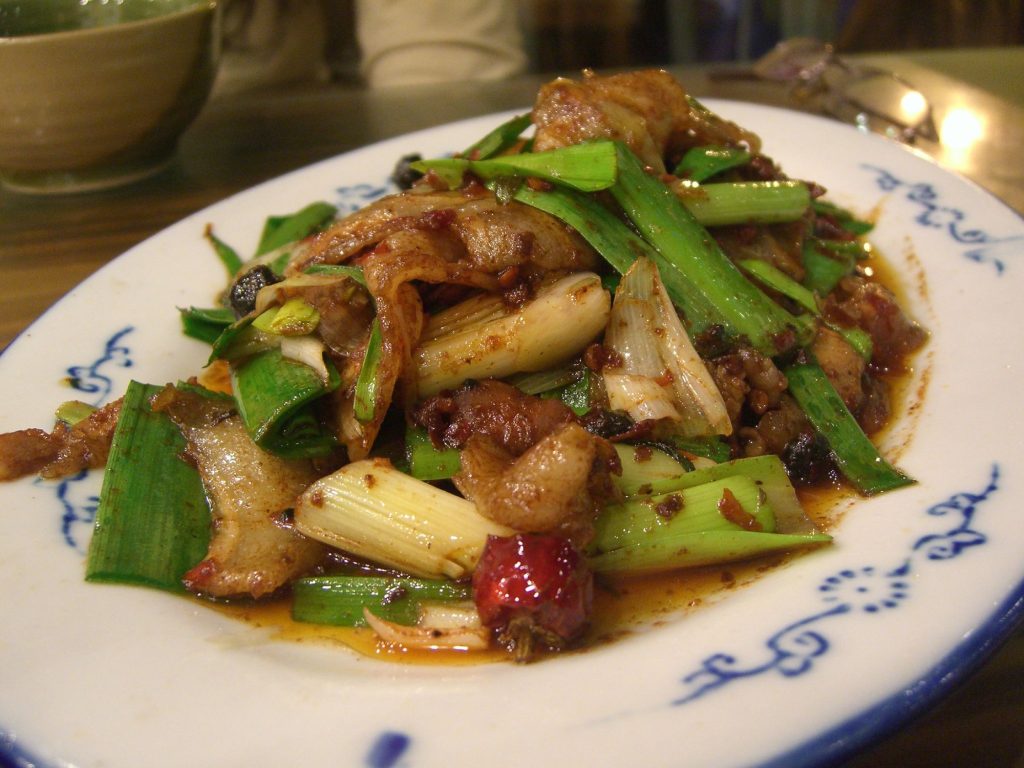 Plate of Sichuan twice-cooked pork huiguorou with green peppers and garlic sprouts