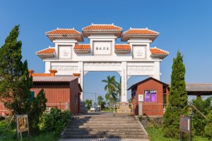 Multi-storey fortified Diaolou watchtowers rising above fields in Kaiping, Guangdong