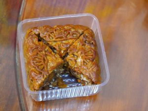 Chinese Mid-Autumn mooncake suggesting holiday planning and festival calendar