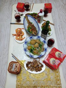 Homemade Mid-Autumn reunion dinner table with dishes arranged for a family meal