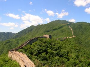Stone watchtowers and ridgeline of the Great Wall at Mutianyu near Beijing under a clear sky