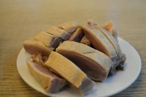 Sliced Nanjing salted duck arranged on a plate