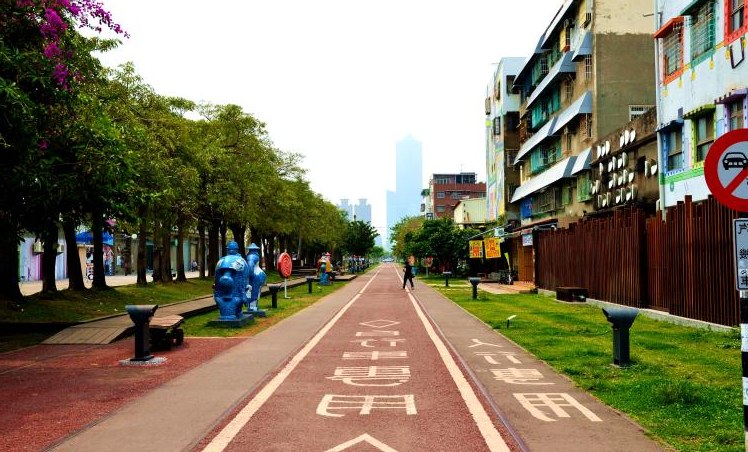 Pier-2 Art Center pedestrian path with blue sculptures and 85 Sky Tower skyline