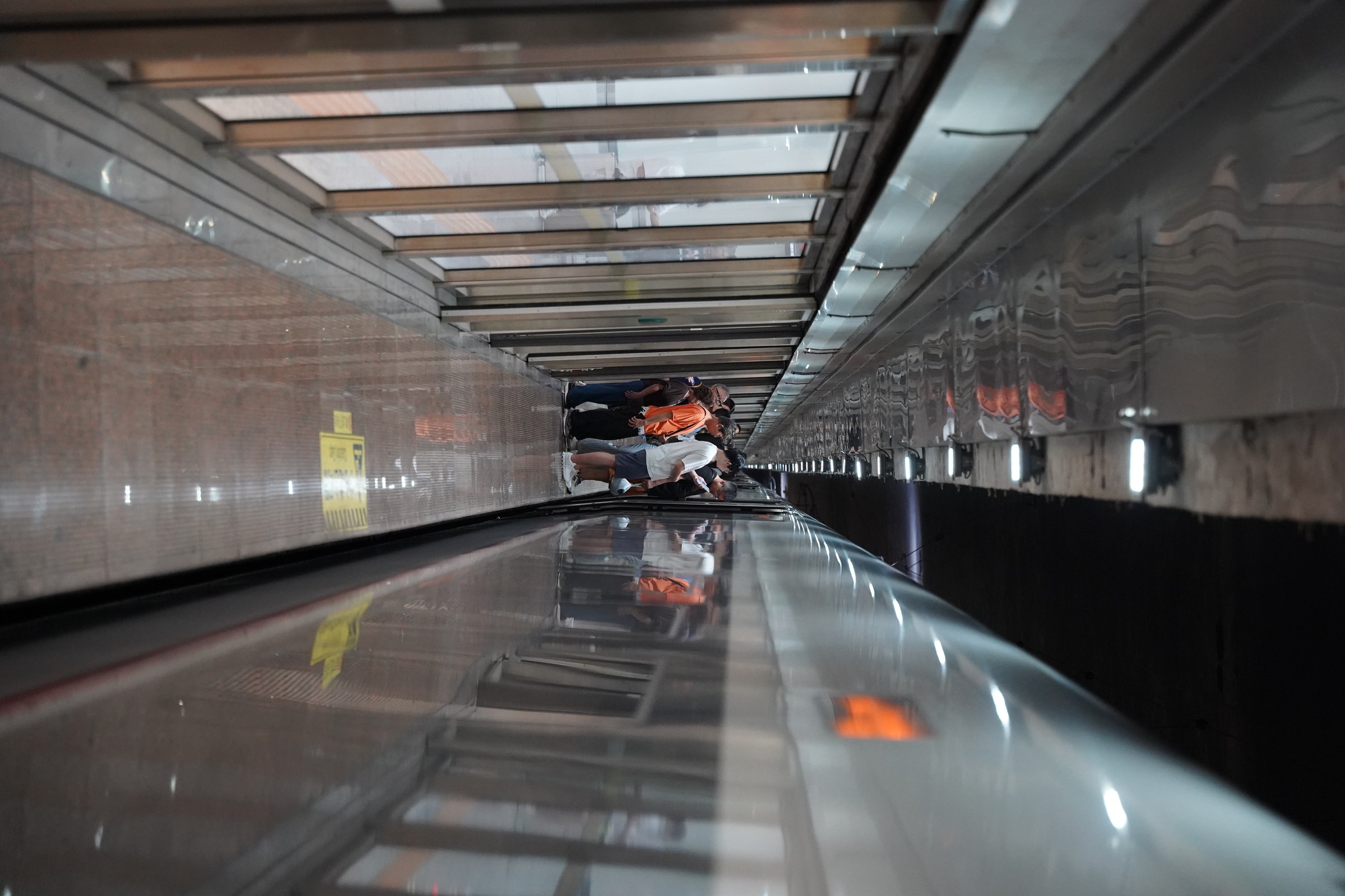 Passengers boarding a high-speed train at a Chinese station