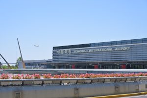 Exterior of Shanghai Hongqiao International Airport Terminal 1 building under a clear sky