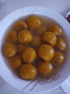 Homemade golden mooncakes cooling after a Mid-Autumn baking session
