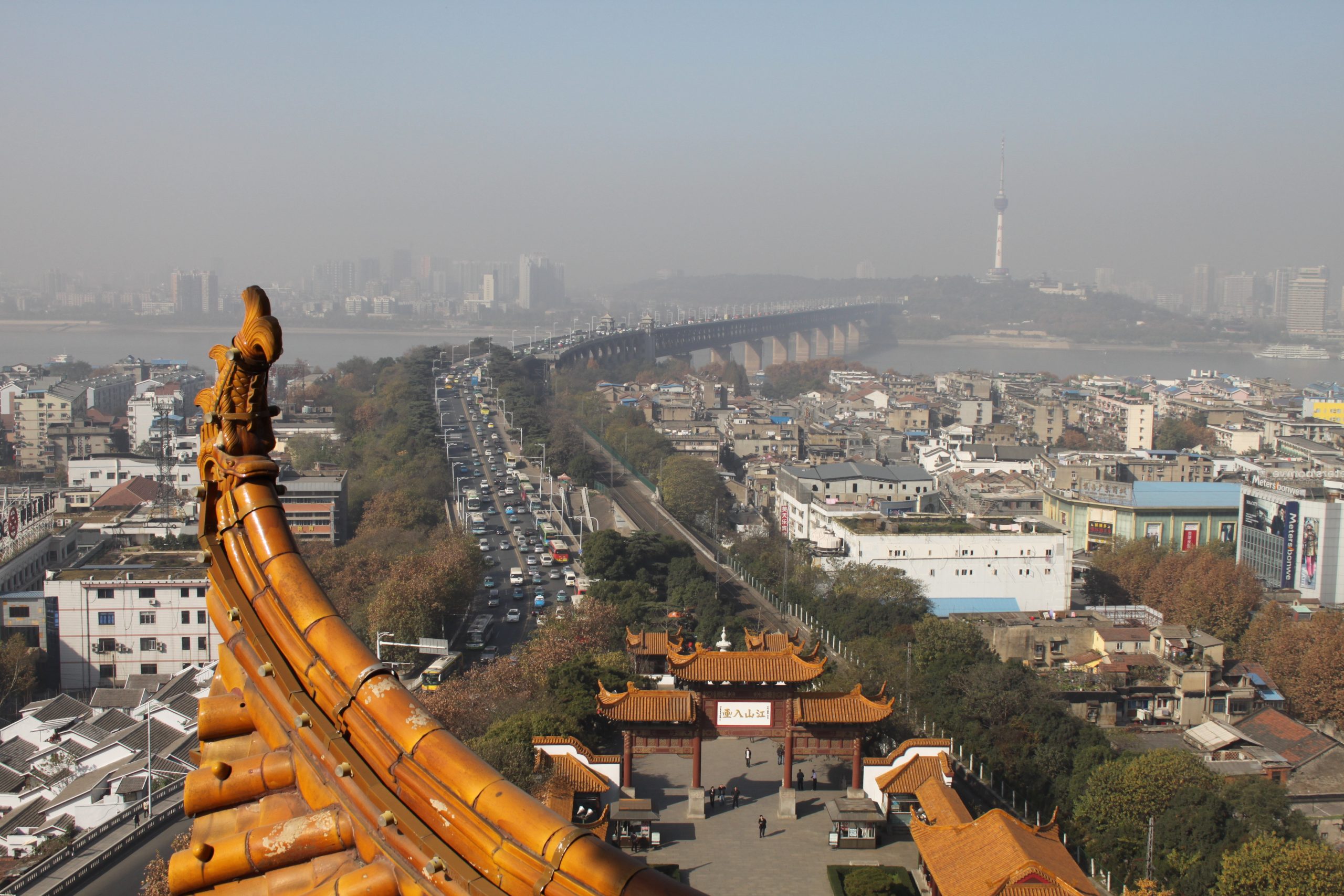 View across the Yangtze River from Yellow Crane Tower toward Wuhan bridges and hills